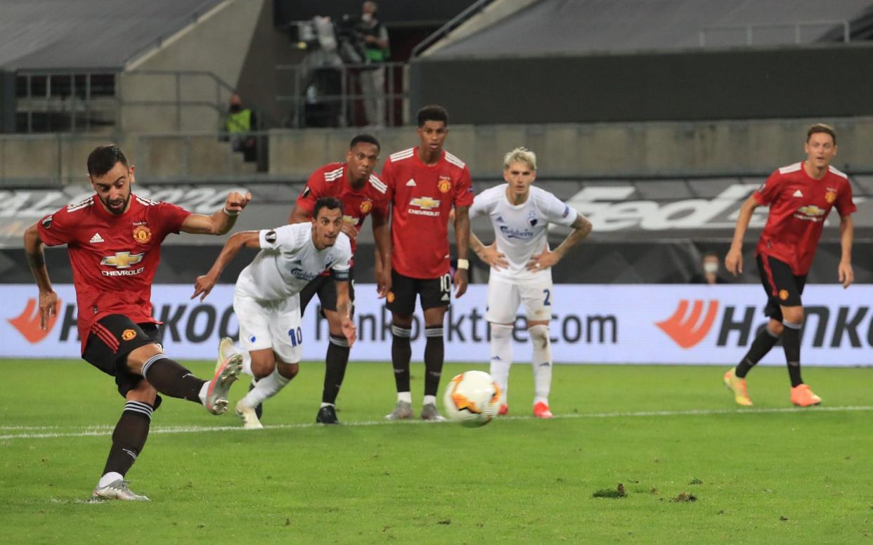 Manchester United's Portuguese midfielder Bruno Fernandes scores a penalty during the UEFA Europa League quarter-final football match between Manchester United and FC Copenhagen  - AFP
