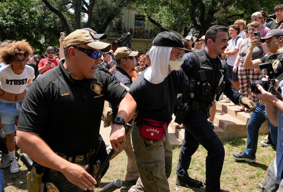 A pro-Palestinian protester is arrrested at the University of Texas Monday April 29, 2024.