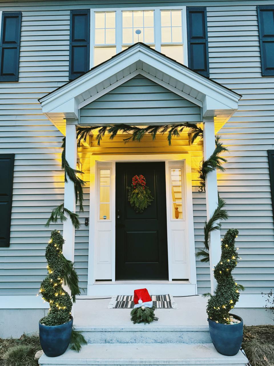 A holiday porch design by SouthCoast Pumpkin Co.