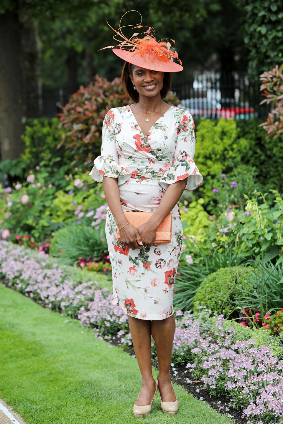 Olympic gold medallist Denise Lewis wearing a floral dress paired with orange accessories. <em>[Photo: Getty]</em>