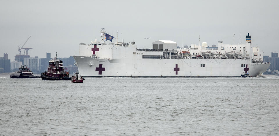 The Navy hospital ship USNS Comfort sails into New York on March 30. The ship initially planned to help treat non-coronavirus patients while hospitals treat people with COVID-19. (Photo: ASSOCIATED PRESS)