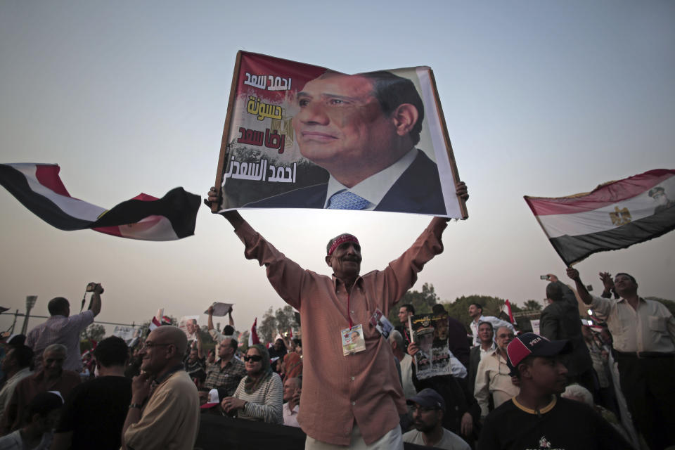 Egyptian supporters of presidential candidate, Abdel-Fattah el-Sissi, chant slogans and dance during a campaign rally in Cairo, Egypt, Saturday, May 10, 2014. El-Sissi, is seen as the overwhelming favorite to win the May 26-27 election. So far, el-Sissi, is riding an overwhelming media frenzy lauding him as Egypt’s savior for overthrowing Islamist President Mohammed Morsi last summer. (AP Photo/Khalil Hamra)