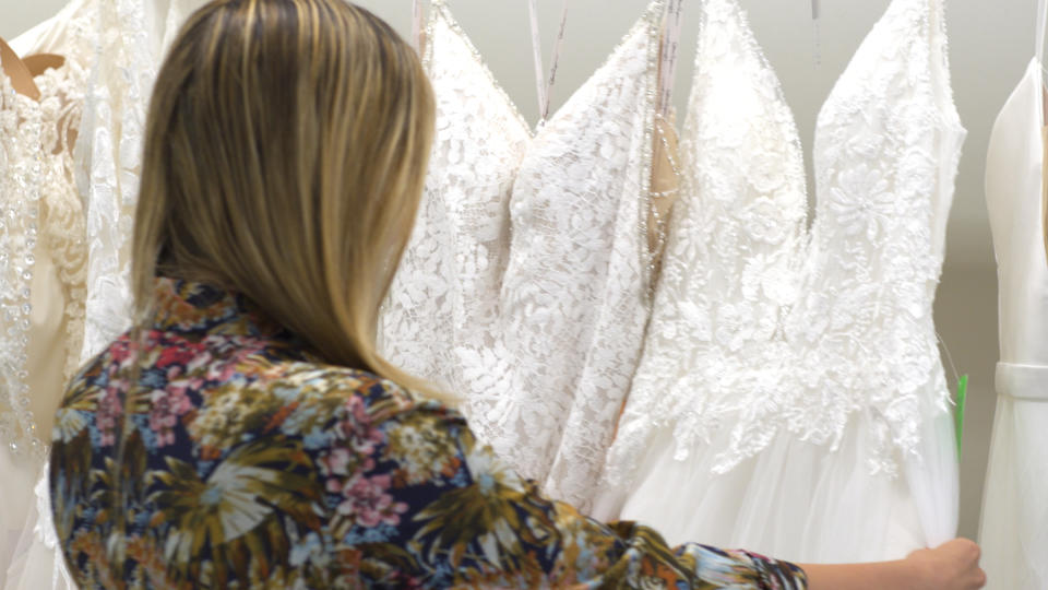 Jen Glantz checks out RK Bridal wedding dress. (Source: Yahoo Finance)