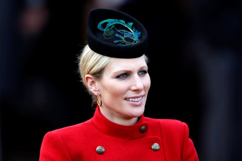 FILE PHOTO: Britain's Zara Phillips smiles in the unsaddling enclosure on Ladies Day at the Cheltenham Festival horse racing meet in Gloucestershire