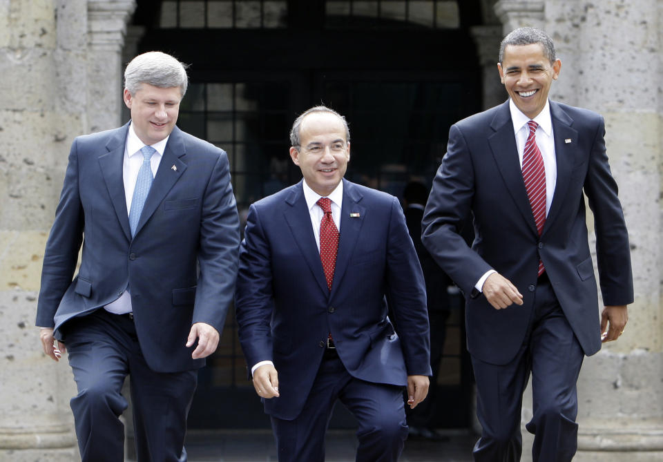 FILE - In this Aug. 10, 2009, file photo, President Barack Obama, right, Mexico's President Felipe Calderon, center, and Canada's Prime Minister Stephen Harper walk towards a stand for an official photo in Guadalajara, Mexico, for a North American summit. Obama is convening a summit with leaders from Mexico and Canada on Monday, April 2, 2012, that aims to boost a fragile recovery and grapple with thorny energy issues against a backdrop of painfully high gas prices. The session at the White House is a make-good for a planned meeting last November in Hawaii on the sidelines of the Asia-Pacific summit. Obama ended up meeting just with Harper when Mexican President Felipe Calderon's top deputy was killed in a helicopter crash. (AP Photo/Alex Brandon, File)