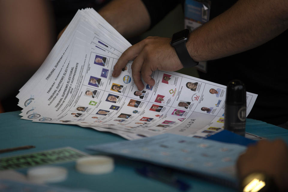 Election officials start counting votes after polls closed during general elections in Guatemala City, Sunday, June 16, 2019. Guatemalans are voting for their next president in elections plagued by widespread disillusion and distrust, and as thousands of their compatriots flee poverty and gang violence to seek a new life in the United States. (AP Photo/Moises Castillo)