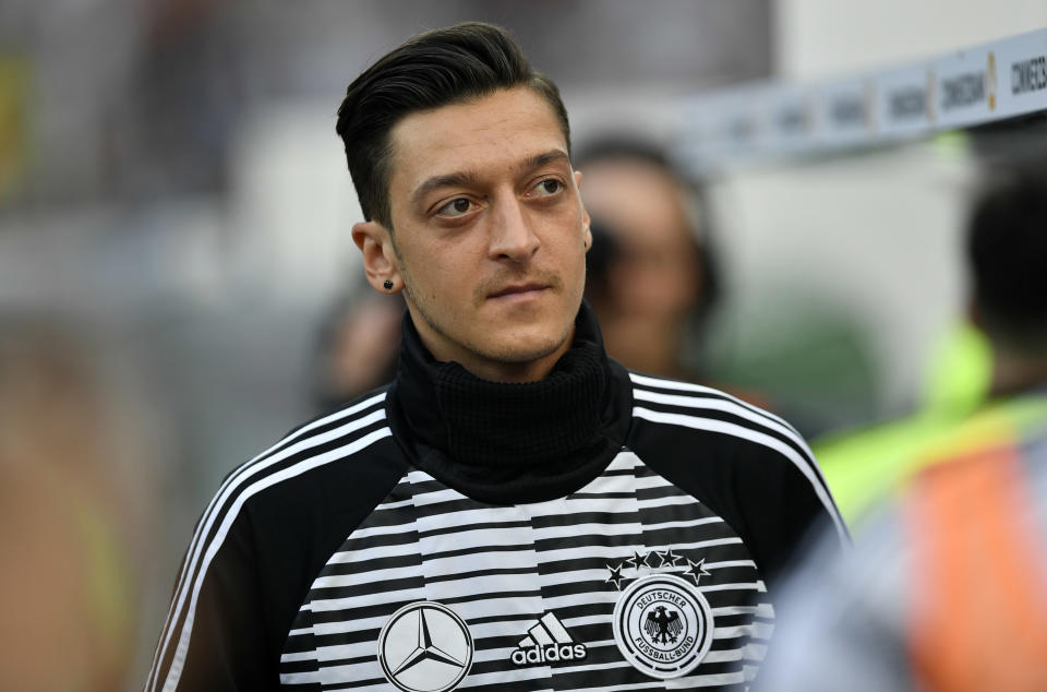 FILE - In this Friday, June 8, 2018 file photo Germany's Mesut Ozil arrives to a friendly soccer match between Germany and Saudi Arabia at BayArena in Leverkusen, Germany. The president of Germany’s football federation DFB, Reinhard Grindel, wishes he had given Mesut Ozil more support against racist attacks following the controversy over the player’s photo with Turkish President Recep Tayyip Erdogan. (AP Photo/Martin Meissner, file)