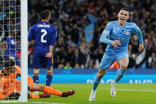 Phil Foden celebrates making it 3-1 in the Champions League semi-final between Manchester City and Real Madrid