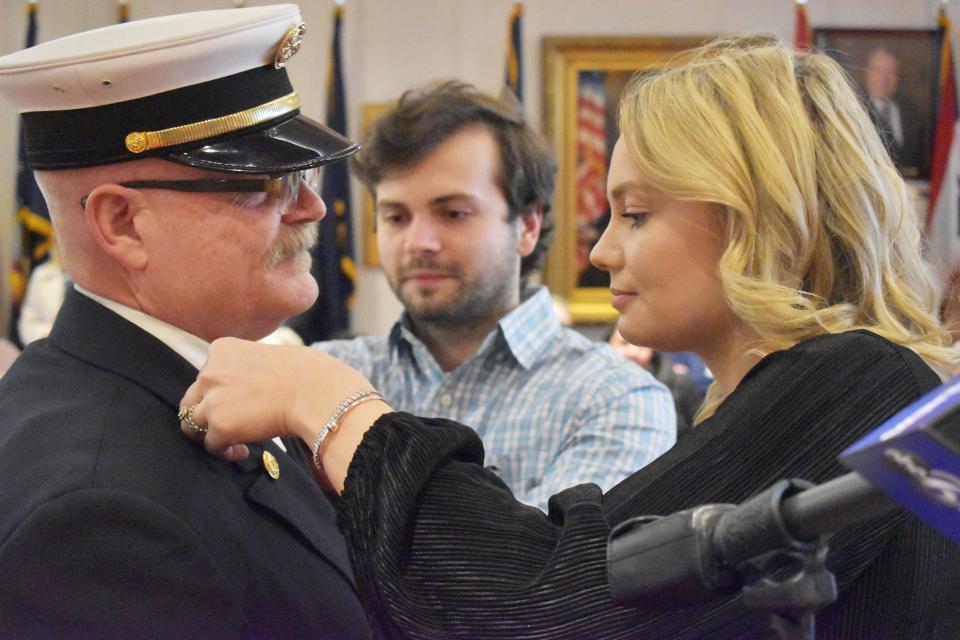 Fire chief Roger St. Martin with son Joshua and daughter Nicole during the Fall River Fire Department promotional ceremony at Government Center Wednesday.