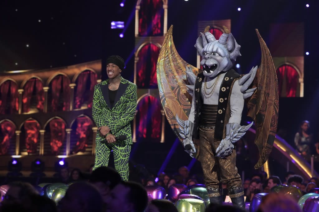 THE MASKED SINGER: L-R: Nick Cannon and Gargoyle in the “Battle of the Saved” episode of THE MASKED SINGER airing Wednesday, April 26 (8:00-9:01 PM ET/PT) on FOX. CR: Michael Becker/FOX. ©2023 FOX Media LLC.