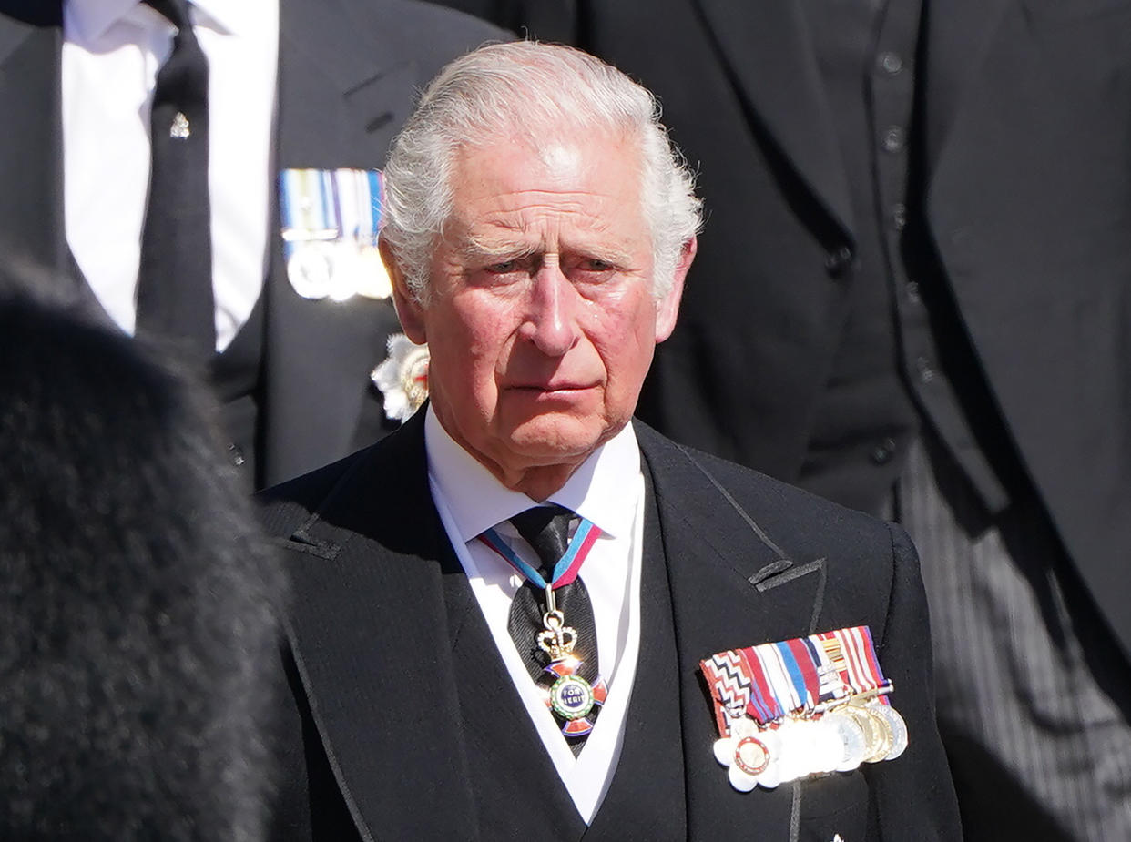 Then Prince Charles, with other family members, follow the coffin during a procession arriving at St George's Chapel for the April 17, 2021, funeral of his father, Prince Philip, inside Windsor Castle in England. (Paul Edwards/Pool)