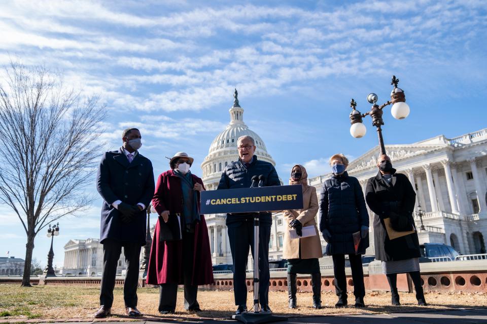 Senator Chuck Schumer, accompanied by from left, Representatives Mondaire Jones, Alma Adams, Ilhan Omar, Senator Elizabeth Warren, and Represenative Ayanna Pressley, in February when they called on Mr Biden to cancel student debt (Getty Images)