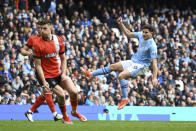 Manchester City's Julian Alvarez, right, makes an attempt to score during the English Premier League soccer match between Manchester City and Luton Town at Etihad stadium in Manchester, England, Saturday, April 13, 2024. (AP Photo/Rui Vieira)