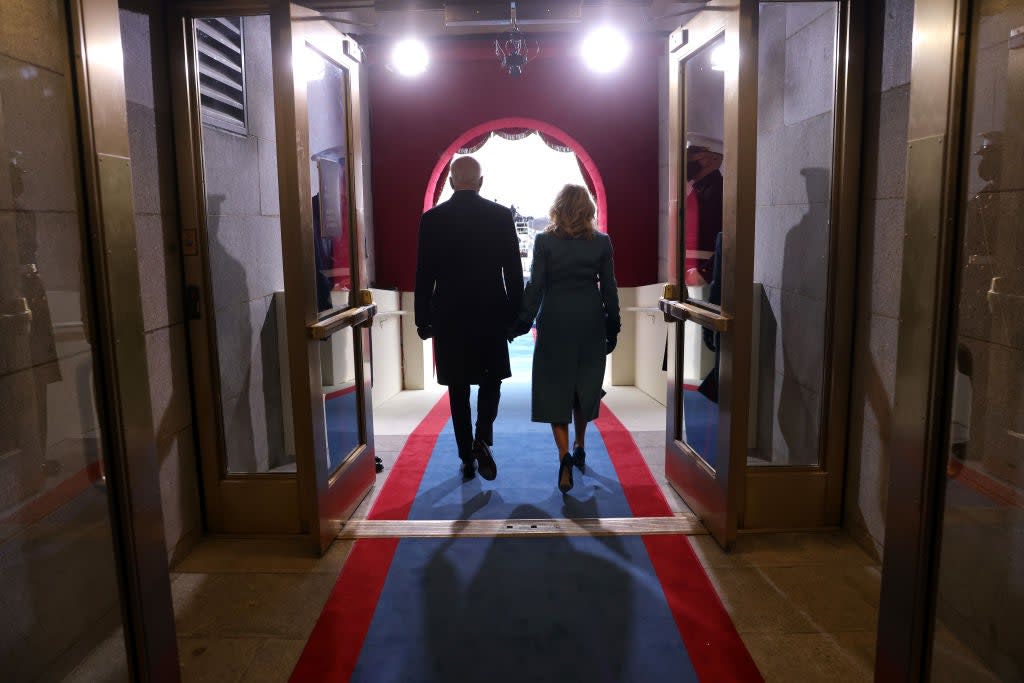 President Joe Biden and First Lady Jill Biden walk onto the front balcony of the US Capitol during his inauguration ceremony. (Getty Images)