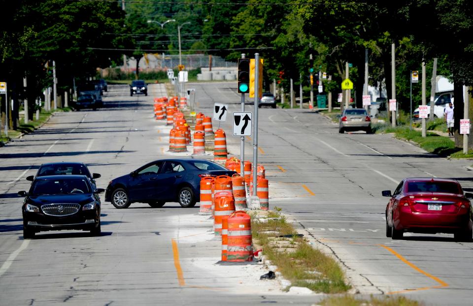 Traffic travels along Villard Avenue at 64th Street where the city recently completed a road diet in Milwaukee. Road diets are where four car lanes will be reduced to two car lanes, with bike lanes and left-turn lanes added.