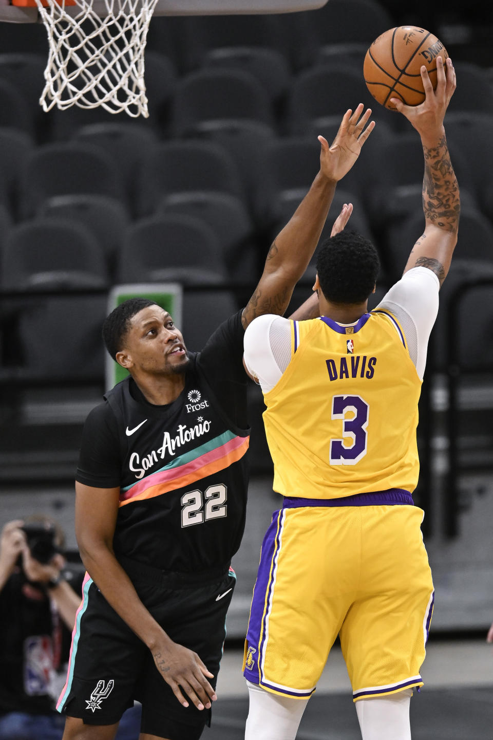 Los Angeles Lakers' Anthony Davis (3) shoots over San Antonio Spurs' Rudy Gay during the first half of an NBA basketball game Friday, Jan. 1, 2021, in San Antonio. (AP Photo/Darren Abate)