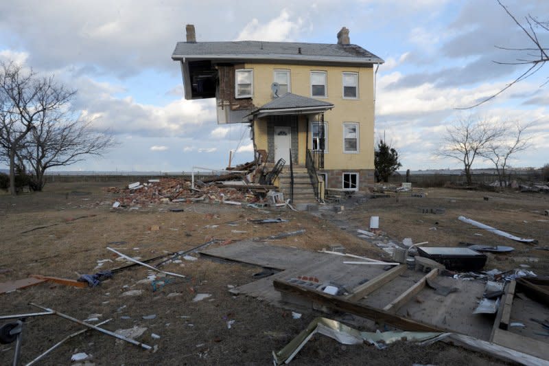 A photo taken in the first week after Hurricane Sandy shows a house nearly destroyed with half of it washed away in Union Beach, N.J. File Photo by Dennis Van Tine/UPI