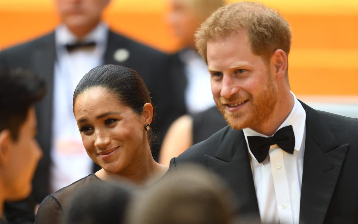 Prince Harry and Meghan at the premiere of The Lion King - James Whatling Photography