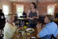 <p>GraceFull Community Cafe owner Heather Greenwood (center) welcomed customers at her restaurant in Littleton, Colorado, in June 2016. GraceFull Cafe serves everyone, regardless of their ability to pay.</p><p><strong>RELATED: </strong><a href="https://www.redbookmag.com/life/g3089/volunteer-opportunities/" rel="nofollow noopener" target="_blank" data-ylk="slk:11 Easy Ways to Give Back;elm:context_link;itc:0;sec:content-canvas" class="link "><strong>11 Easy Ways to Give Back</strong></a></p>