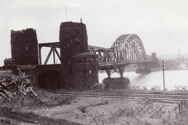 The Ludendorff Bridge over the Rhine between Erpel (foreground, east side) and Remagen (background, west side) after it was captured by U.S. troops on March 7, 1945. File Photo courtesy of the U.S. Signal Corps