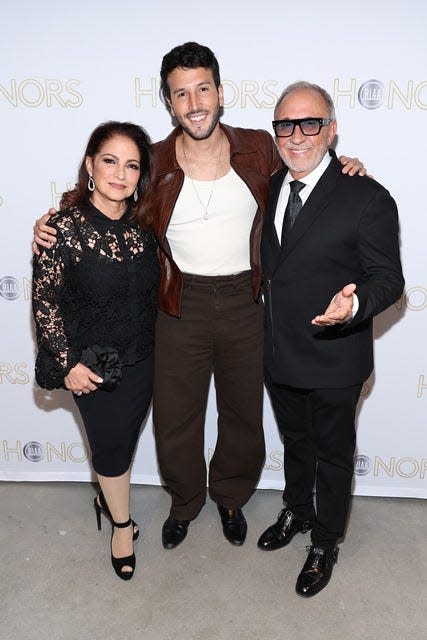 Gloria Estefan (left), Sebastian Yatra and Emilio Estefan share a moment before the RIAA Latin Honors last month in Washington.