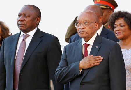 FILE PHOTO: South Africa's Deputy President Cyril Ramaphosa and President Jacob Zuma stand during the playing of the national anthem at the opening of Parliament in Cape Town, February 11, 2016. REUTERS/Mike Hutchings/File Photo