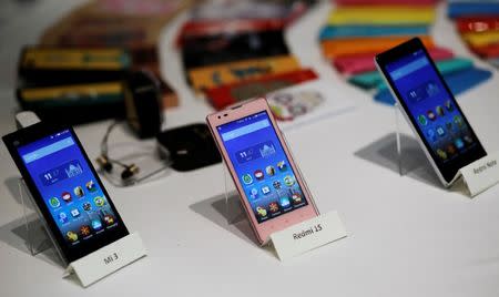 Three models of China's Xiaomi Mi phones are pictured during their launch in New Delhi, India, July 15, 2014. REUTERS/Anindito Mukherjee/Files