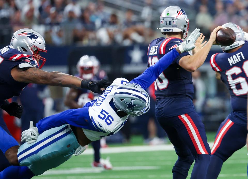 Dallas Cowboys defensive end Dante Fowler Jr. (56) dives at New England Patriots quarterback Mac Jones during the first half of Sunday's 38-3 win at AT&T Stadium in Arlington. The Cowboys improved to 3-0 and visit 4-1 San Francisco Sunday.