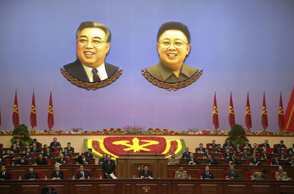 FILE - In this May 9, 2016, file photo, the portraits of late North Korean leaders Kim Il Sung, left, and Kim Jong Il hang inside the convention hall of the April 25 House of Culture where the party congress is held in Pyongyang, North Korea. North Korea has opened its biggest political event in five years amid what some experts see as the most fraught moment of leader Kim Jong Un’s nine-year rule. (AP Photo/Wong Maye-E, File)