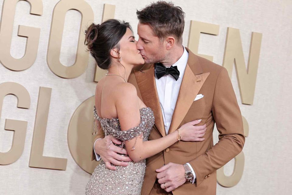 <p>John Salangsang/Golden Globes 2024/Golden Globes 2024 via Getty</p> Sofia Penas and Justin Hartley kiss on 81st Golden Globe Awards red carpet