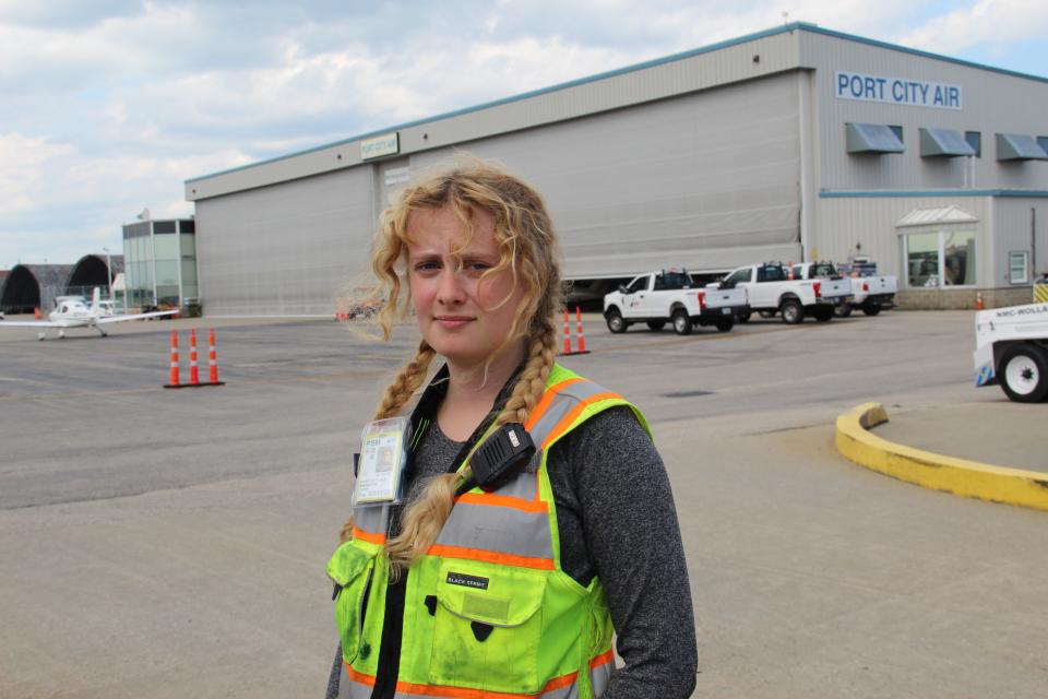 Madeline Tate, 26, of Newmarket, a line service technician for Port City Air, battles the heat on the job at Portsmouth International Airport at Pease Tuesday, Aug. 2, 2022.