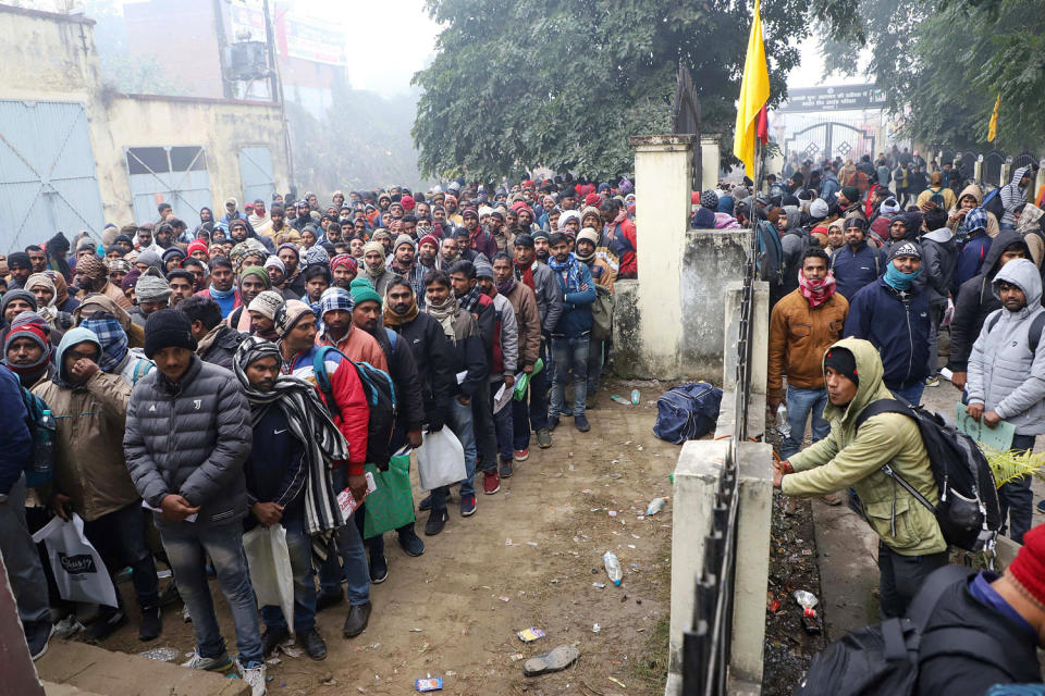 Indian workers submit registration forms seeking employment in Israel during a recruitment drive at the Industrial Training Institute (ITI) in Lucknow, capital of India's Uttar Pradesh state on January 25, 2024. (Naeem Ansari / AFP - Getty Images)