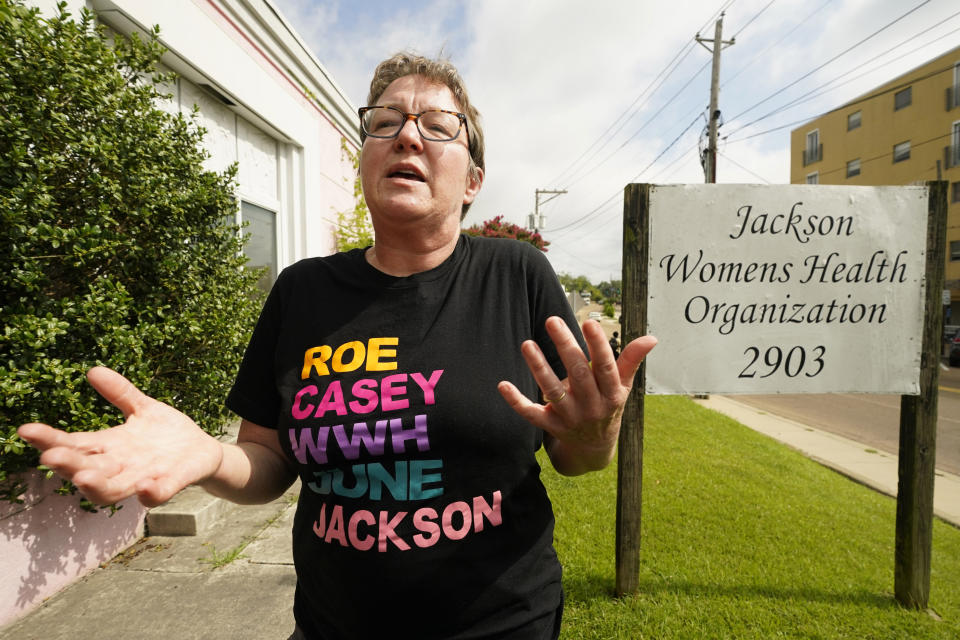 Dr. Cheryl Hamlin speaks with reporters outside the Jackson Women's Health Organization clinic in Jackson, Miss., Wednesday, July 6, 2022. Hamlin is one of a rotating group of physicians that provide abortions at the clinic which is the only facility that performs abortions in the state. On Tuesday, a chancery judge rejected a request by the clinic to temporarily block a state law banning most abortions. Without other developments in the Mississippi lawsuit, the clinic will close at the end of business Wednesday and the state law will take effect Thursday. (AP Photo/Rogelio V. Solis)