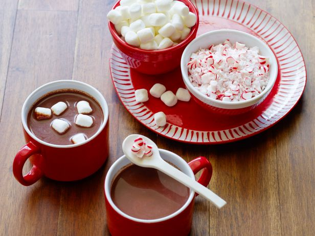 <p>Made and served in the same pot, our slow-cooker cocoa is thickened and enriched with dark chocolate. Set up an add-ons bar beside the cooker (mini marshmallows, crushed candies and peppermint schnapps take cocoa to a whole new holiday level), then stick a ladle in the pot and let guests help themselves. <b><a href="http://www.foodnetwork.com/recipes/food-network-kitchens/slow-cooker-peppermint-hot-chocolate.html?oc=PTNR-YahooFood-slow-cooker-holiday-party" rel="nofollow noopener" target="_blank" data-ylk="slk:Get the recipe >>;elm:context_link;itc:0" class="link ">Get the recipe >></a></b></p>