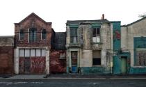 <p>A row of empty buildings memorializes a small-town Main Street that once was.</p>