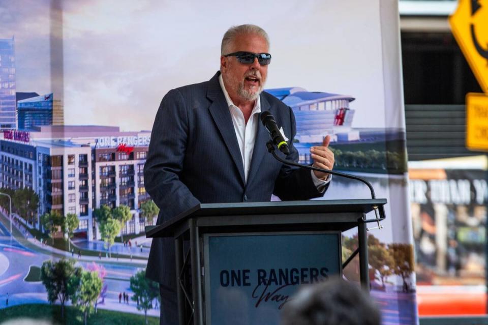 Arlington Mayor Jim Ross speaks to a crowd during the topping off ceremony for One Rangers Way on Monday. Ross spoke about the his appreciation toward everyone who worked on the project.