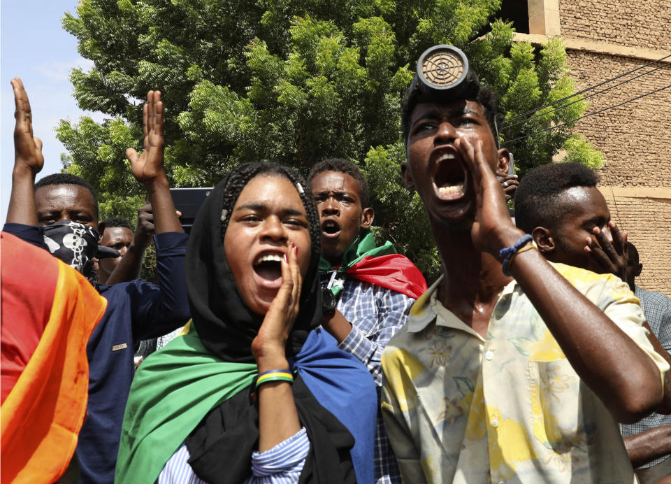Sudanese protesters gather outside the Cabinet’s headquarters in the capital, Khartoum, Sudan, Monday, Aug. 17, 2020. Protesters returned to the streets Monday to pressure transitional authorities for more reforms, a year after a power-sharing deal between the pro-democracy movement and the generals. (AP Photo/Marwan Ali)
