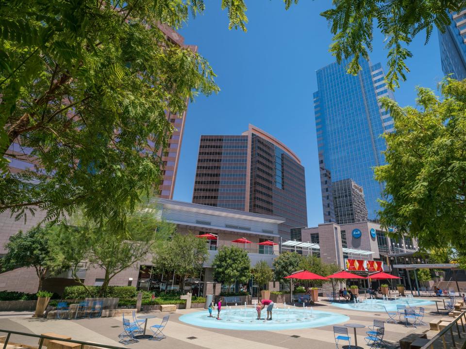 Sunny day and clear blue sky above business center and tall skyscrapers in downtown capital city of Phoenix, Arizona