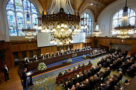 FILE PHOTO: United Nations Secretary-General Ban Ki-moon, down left corner behind lectern, speeches during a ceremony marking the 70th anniversary of the International Court of Justice in The Hague, Netherlands, Wednesday, April 20, 2016. REUTERS/Peter Dejong/Pool/File Photo