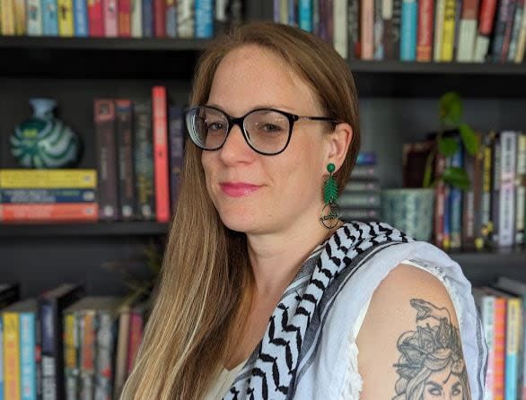 When Amy McKie moved back home to P.E.I. from Toronto, she was looking for a way to connect with other members of the Island's 2SLGBTQA+ community. So she started a queer reading circle.  (Andrew Low - image credit)