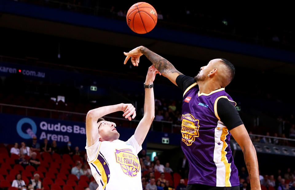 Nick Kyrgios, pictured here blocking a shot by Dominic Perrottet during the Sydney Kings Starlight Celebrity Game.