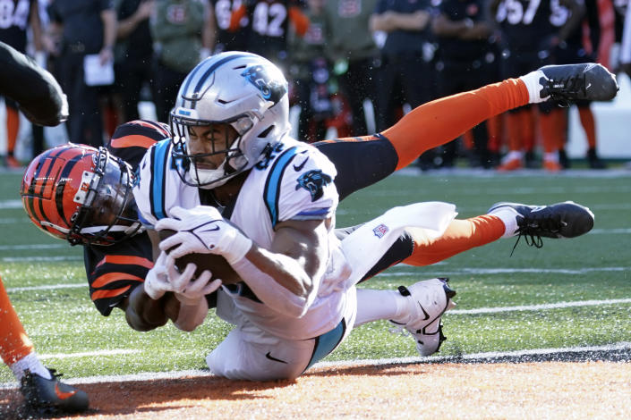 Carolina Panthers tight end Tommy Tremble (82) makes a touchdown catch as Cincinnati Bengals safety Dax Hill (23) defends during the second half of an NFL football game, Sunday, Nov. 6, 2022, in Cincinnati. (AP Photo/Joshua A. Bickel)