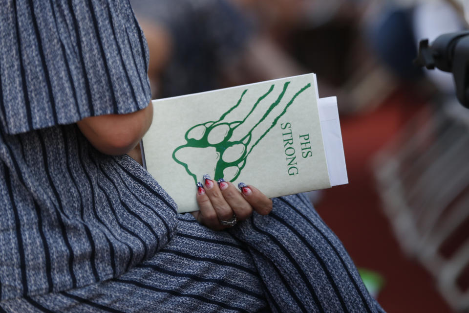 The program for the graduation ceremonies of Paradise High School is seen in Paradise, Calif., Thursday June 6, 2019. Most of the students of Paradise High lost their homes when the Camp Fire swept through the area and the school was forced to hold classes in Chico. The seniors gathered one more time at Paradise High for graduation ceremonies. (AP Photo/Rich Pedroncelli)