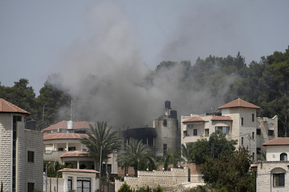 Smoke rises during an Israeli military operation in the West Bank city of Jenin, Friday, July 5, 2024. The Israeli military said Friday it was conducting counterterrorism activity that included an airstrike in the area of the West Bank city of Jenin. Palestinian authorities said five people were killed. (AP Photo/Majdi Mohammed)