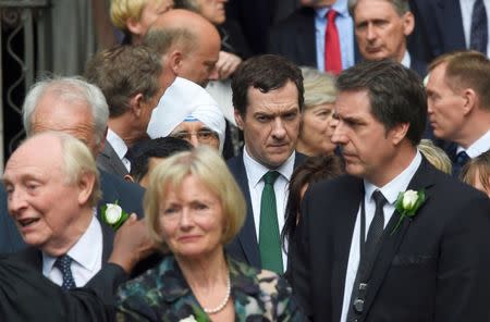 Britain's Chancellor of The Exchequer George Osborne leaves with other members of Parliament after a service of rememberance for Labour MP Jo Cox who was shot and stabbed to death last week outside her constituency surgery, in Westminster, London, June 20, 2016. REUTERS/Toby Melville