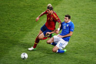 KIEV, UKRAINE - JULY 01: Fernando Torres of Spain is tackled by Andrea Barzagli of Italy during the UEFA EURO 2012 final match between Spain and Italy at the Olympic Stadium on July 1, 2012 in Kiev, Ukraine. (Photo by Martin Rose/Getty Images)