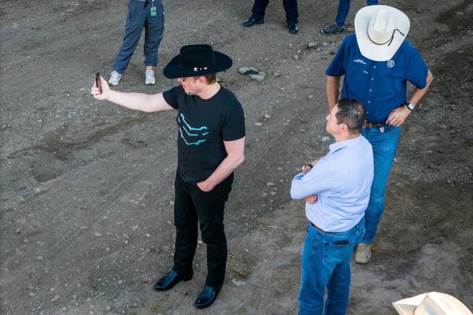 An aerial view of tech entrepreneur Elon Musk, wearing a black Stetson hat, livestreaming while visiting the Texas-Mexico border on September 28, 2023 in Eagle Pass, Texas.