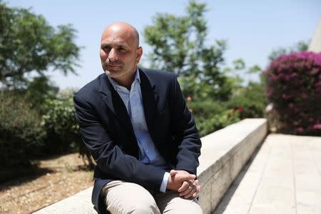 Lior Yavne, founder and director of Akevot, an Israeli NGO researching the Israeli-Palestinian conflict, speaks to Reuters during his interview at the Central Zionist Archives in Jerusalem May 10, 2017. Picture taken May 10, 2017. REUTERS/Ronen Zvulun