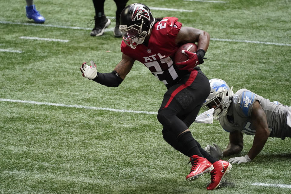 Atlanta Falcons running back Todd Gurley (21) runs for a touchdown against the Detroit Lions during the second half of an NFL football game, Sunday, Oct. 25, 2020, in Atlanta. (AP Photo/John Bazemore)