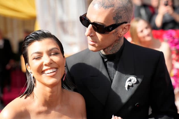 Kourtney Kardashian (left,) and Travis Barker at the Oscars in May. (Photo: AP Photo/John Loche)